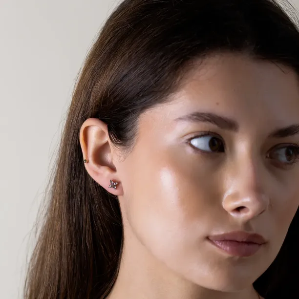 FLORIS salt and pepper diamond earring worn on the ear