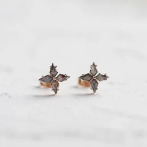 Angled view of the floral FLORIS salt and pepper diamond earrings