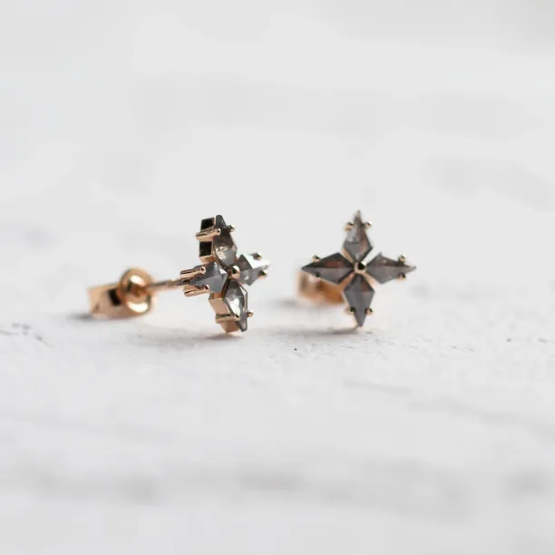 Angled view of the FLORIS salt and pepper diamond earrings