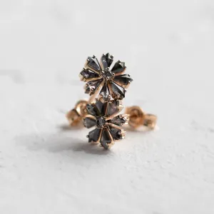 Close-up of FLOWER floral earrings with salt and pepper diamonds