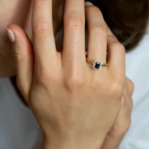 MILLIE engagement ring with a blue radiant-cut diamond worn on the hand