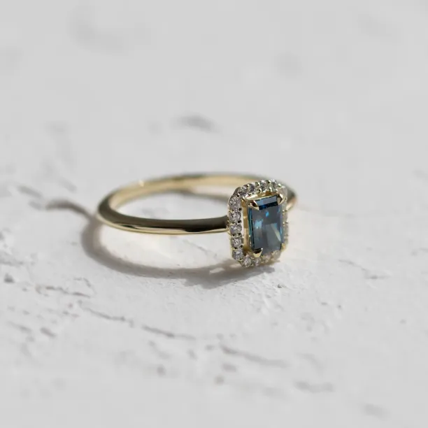 Angled view of the MILLIE lab-grown diamond ring showing the full band