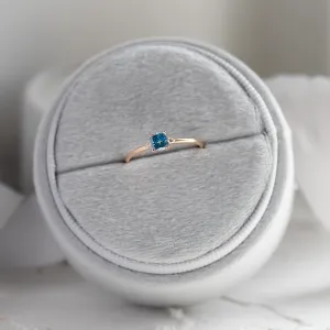 ARCTIS gold ring shown from above with a cushion-cut blue lab-grown diamond