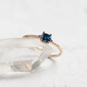 Close-up of the ARCTIS ring setting with a blue lab-grown diamond and white diamonds