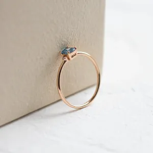 Side view of the ARCTIS gold ring showing the blue lab-grown diamond setting