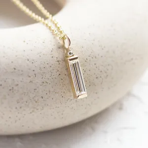 Angled close-up of the FELIANA pendant with baguette moissanite and diamond