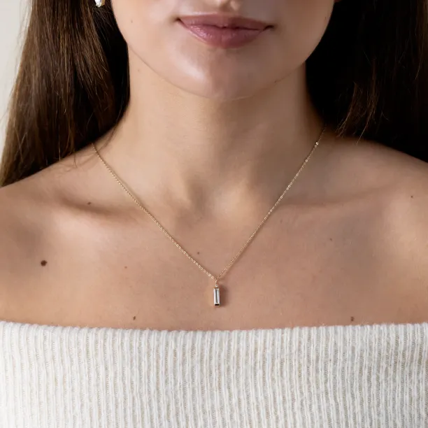 FELIANA pendant necklace with baguette moissanite and diamond worn on the chest