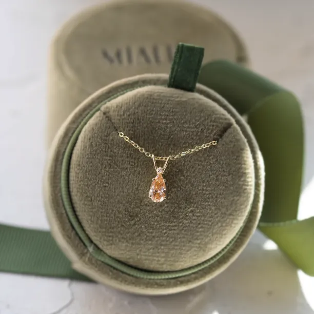 Full view of the gold SOLARIS pendant with orange lab-grown diamond