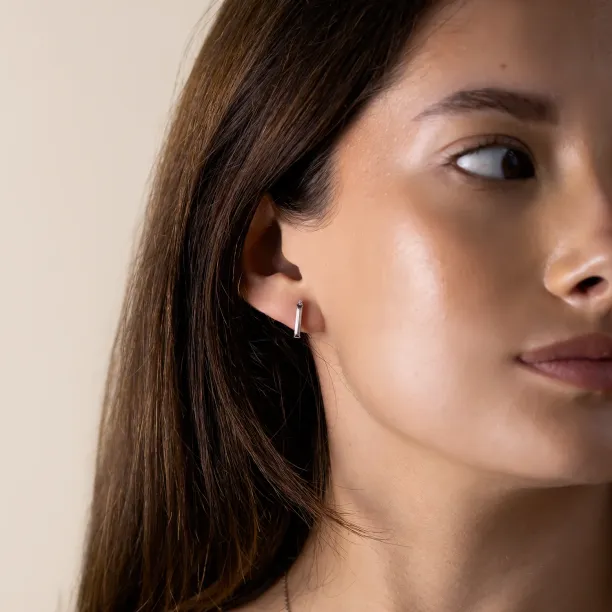 FELICIS moissanite and diamond earring worn on the ear