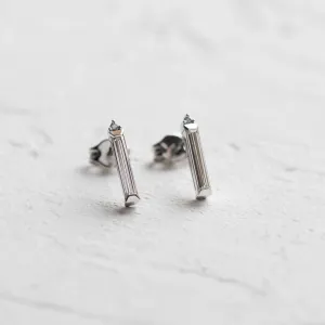 Angled view of FELICIS moissanite and diamond earrings