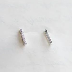 Angled pair of FELICIS moissanite and diamond earrings