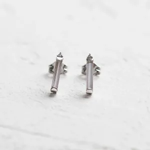 Close-up of FELICIS moissanite and diamond stud earrings