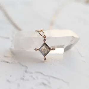 CRESSIDA necklace pendant close-up highlighting the salt and pepper diamond inclusions