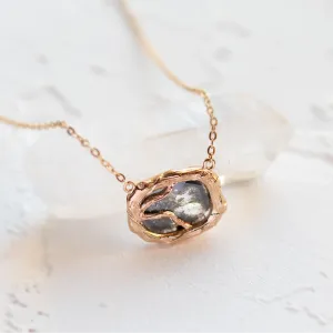 Close-up of the TREASURE necklace’s salt and pepper diamond pendant