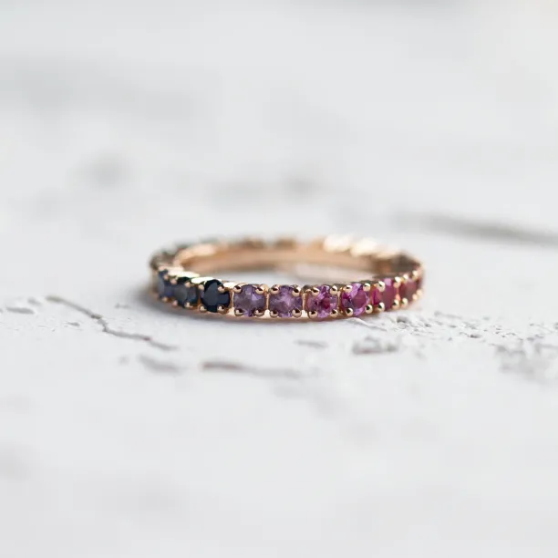 Close-up of the MOSAIC ring's colorful sapphires around the band
