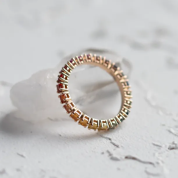 Underside view of the MOSAIC ring with colorful sapphires