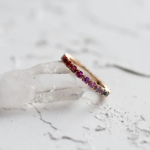 Angled close-up of the MOSAIC rainbow sapphire ring with colorful sapphires