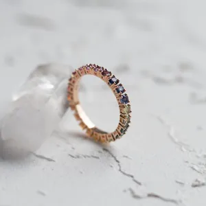 Angled view of the rainbow sapphire eternity ring showing its inner surface