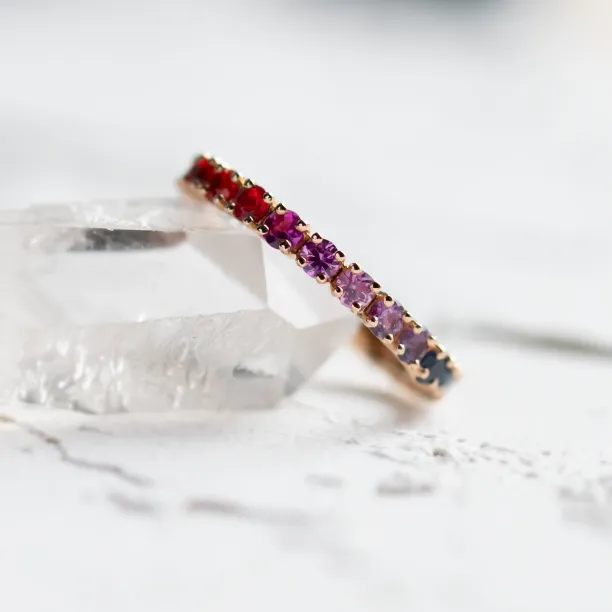 Close-up of the MOSAIC ring’s colorful sapphires in a continuous row