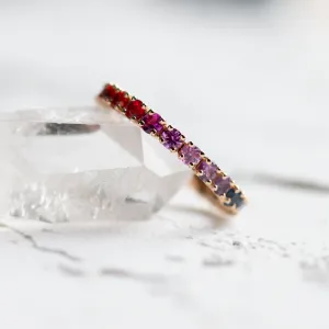 Close-up of the MOSAIC ring’s colorful sapphires in a continuous row