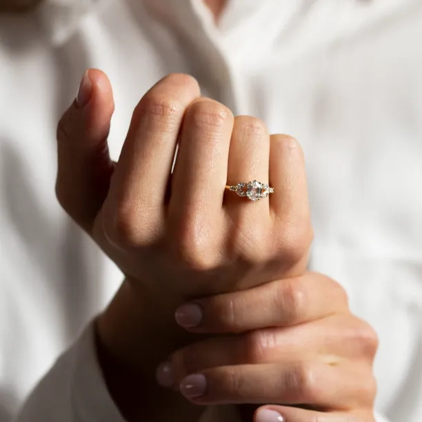 CAIRA lab-grown diamond engagement ring shown on a hand