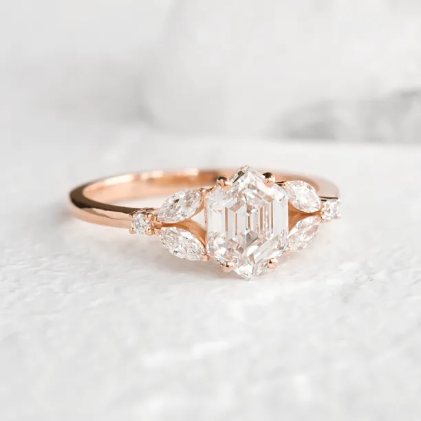 CAIRA lab-grown diamond engagement ring with a rectangular center stone and side diamonds
