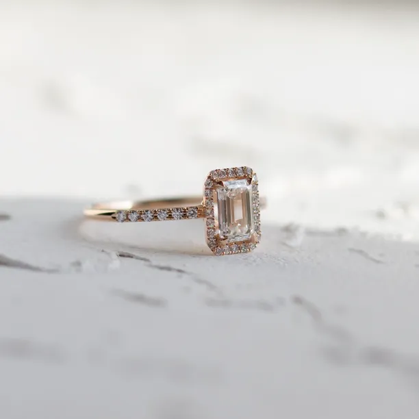 Angled view of the CELESTE lab-grown diamond engagement ring and pavé band