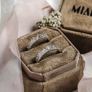 MONTE platinum mountain-inspired wedding rings in a ring box