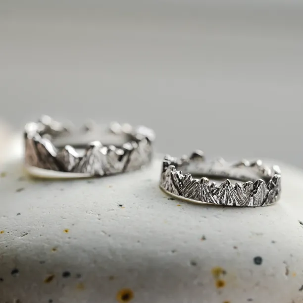 Pair of MONTE platinum wedding rings with mountain relief