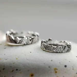 Pair of MONTE platinum wedding rings with mountain relief