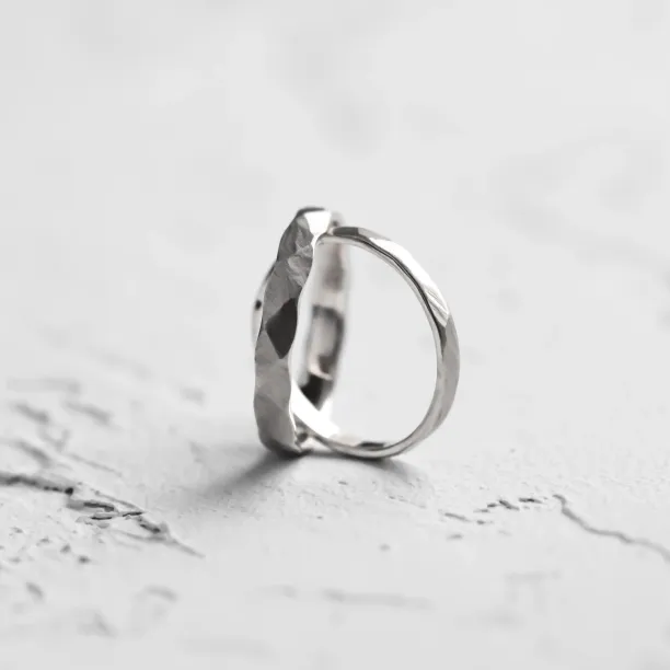 Angled close-up of an ETA matte platinum wedding band