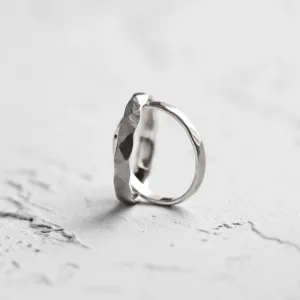Angled close-up of an ETA matte platinum wedding band
