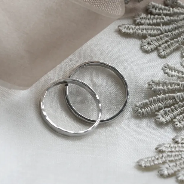 Angled view of ETA platinum wedding bands showing their interiors