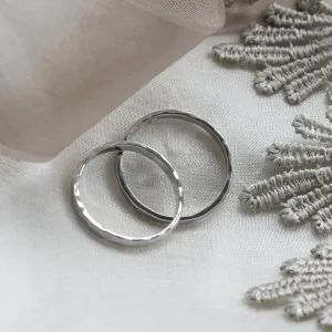 Angled view of ETA platinum wedding bands showing their interiors