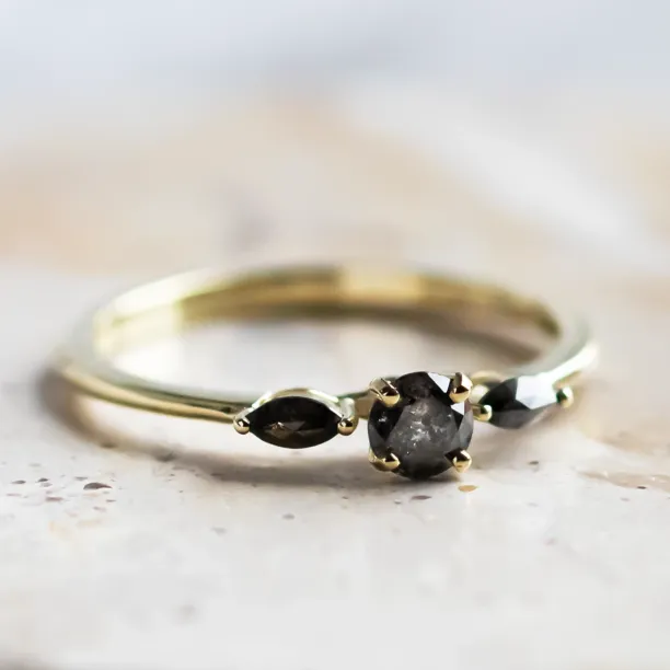 Close-up angled view of salt and pepper diamond ring RINA