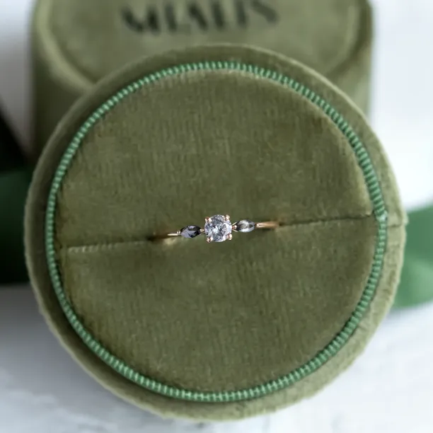 Full view of RINA gold ring with three salt and pepper diamonds