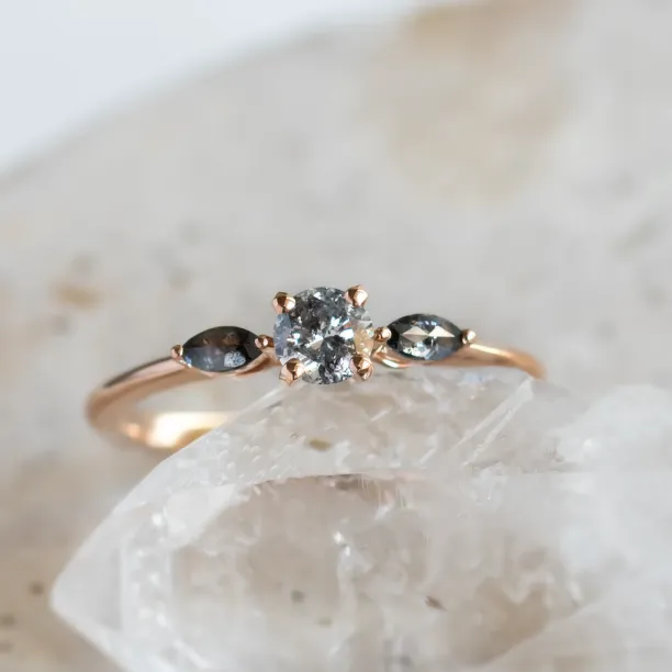 Close-up of the three-diamond setting on the RINA salt and pepper diamond ring
