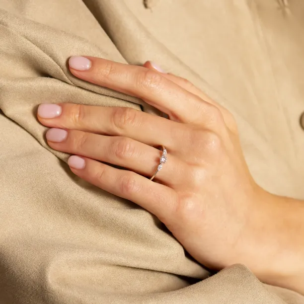 Gold diamond engagement ring DARA worn on a hand