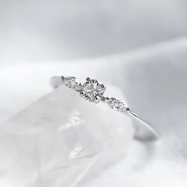 Angled close-up of diamond engagement ring DARA with three diamonds
