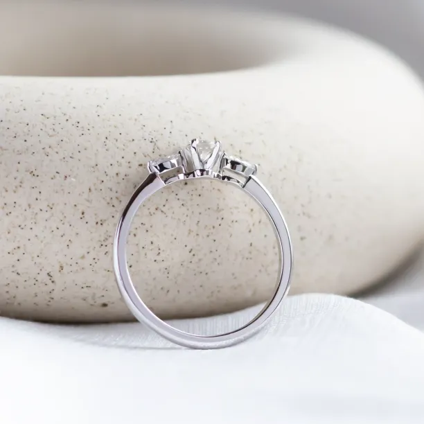 Diamond engagement ring DARA, angled rear view showing the band and three-diamond setting