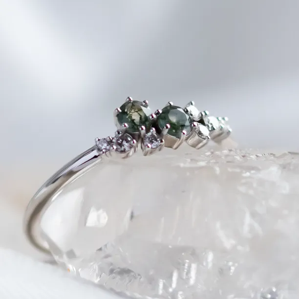 Close-up angled view of the moss agate and diamond cluster ring CLARION