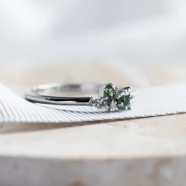 Side view of the CLARION ring with its moss agate and diamond cluster