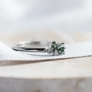 Side view of the CLARION ring with its moss agate and diamond cluster