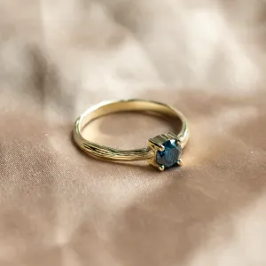Side view of the BLU engagement ring with a blue lab-grown diamond