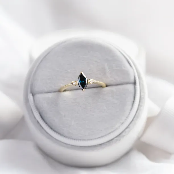 ADINA gold ring with a blue marquise diamond, shown in full view