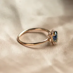 Side view of the ZARIA ring showing its raised teal sapphire setting