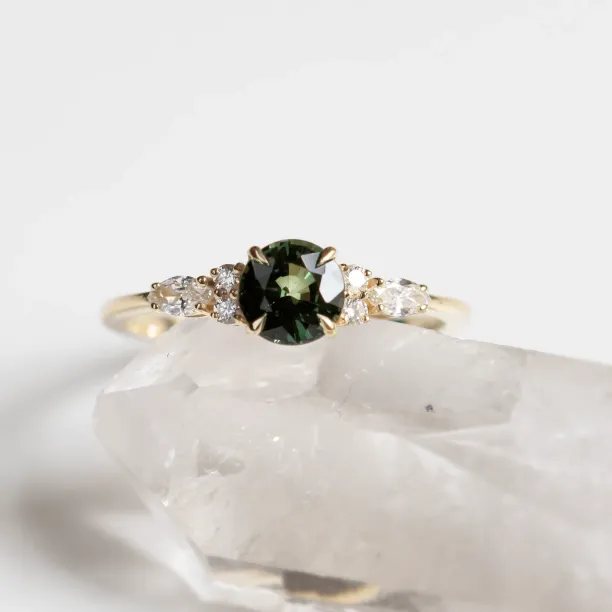Close-up of the MAIDEN engagement ring with sapphire and diamond setting