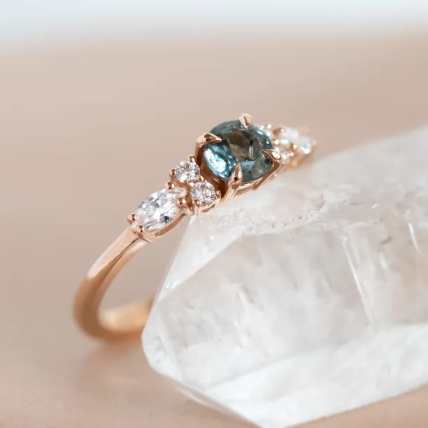 Angled close-up of the MAIDEN ring’s sapphire and diamond setting