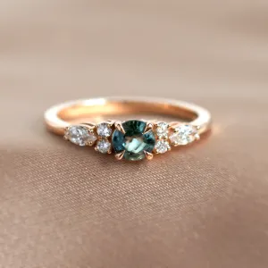 MAIDEN engagement ring with a natural green sapphire and side diamonds