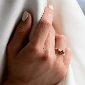 MAIDEN natural green sapphire and diamond engagement ring worn on a finger